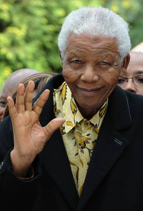 President Nelson Mandela waving after casting his vote in South Africa's general elections in Johannesburg (2012). Picture AFP/ALEXANDER JOE