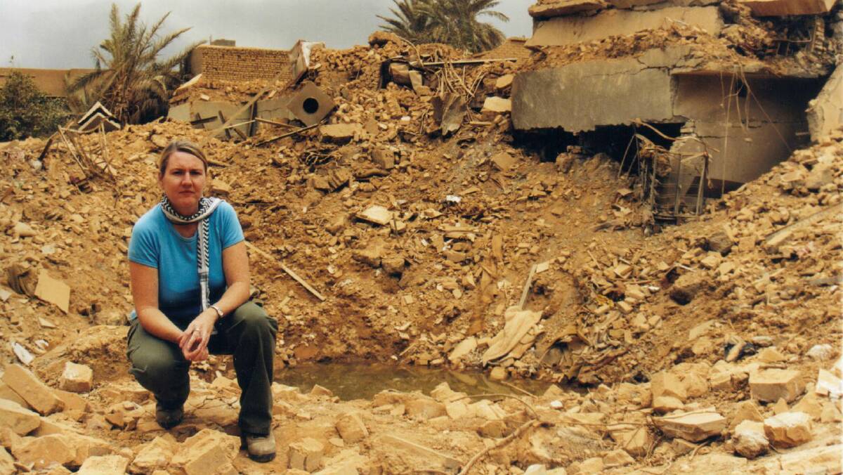 Journalist Donna Mulhearn at a bomb site in Baghdad during the war, in 2003.