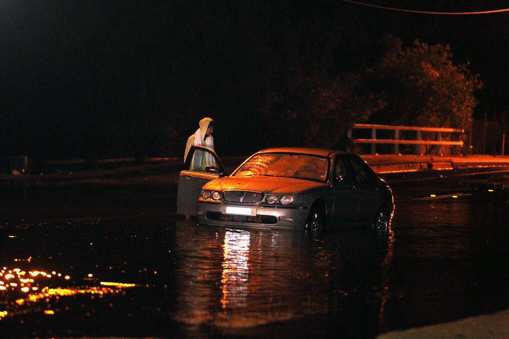 Scenes from George Street, Warilla, on Friday night. Picture: SYLVIA LIBER