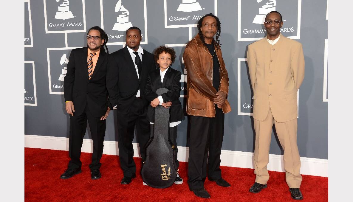 Musicians Desi Hyson, Paapa Nyarkoh, Al Anderson and Steve Samuels of the Original Wailers with guest (C) arrive at the 55th Annual GRAMMY Awards.