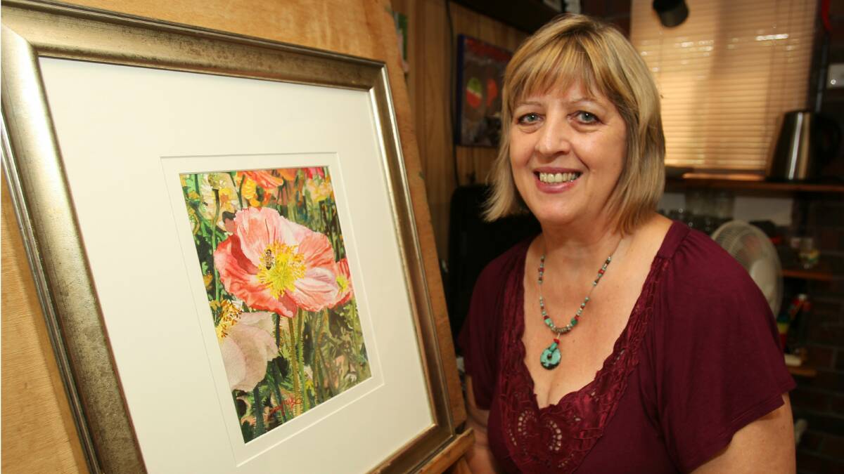  Artist Jutta Chalk with her painting of poppies for the Wollongong Seniors Week art and photography competition. Picture: GREG TOTMAN