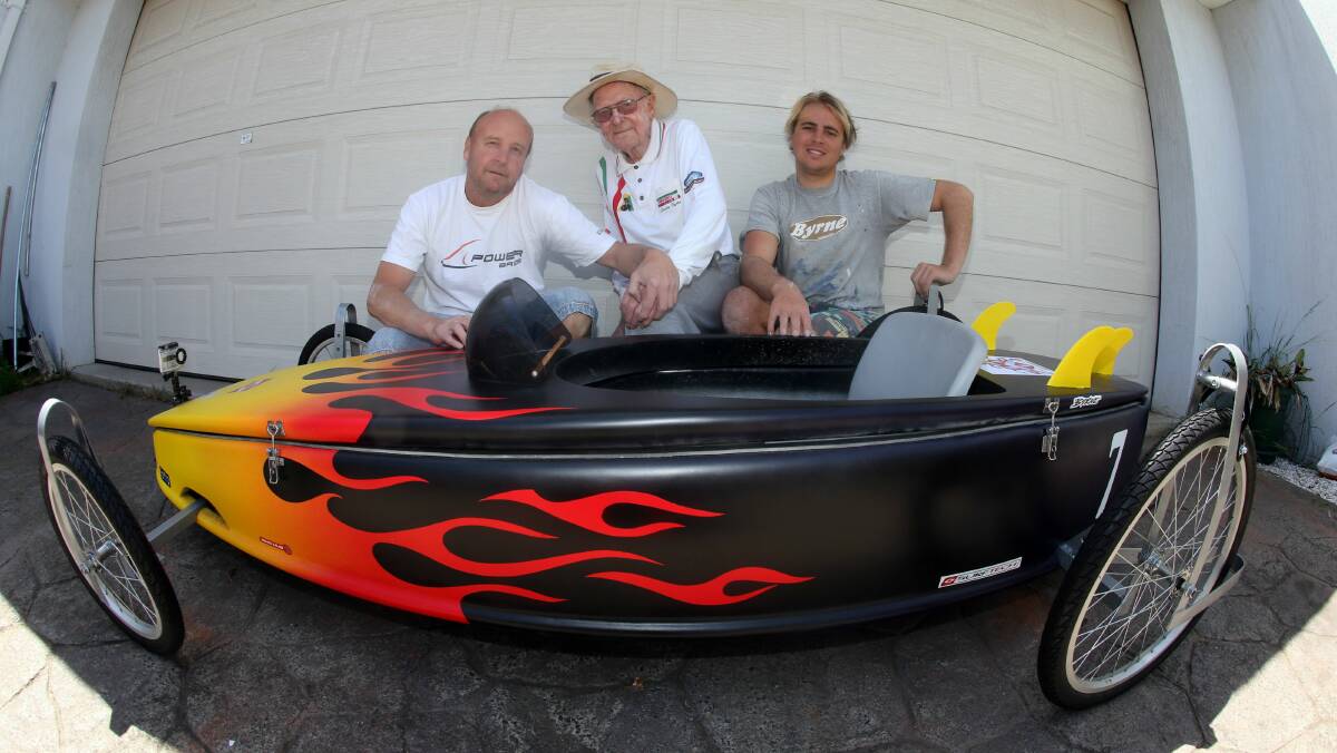 Tony Byrne, Laurie Byrne and Parrish Byrne with Port Kembla Billy Cart Derby entry the Raven. Picture: ROBERT PEET