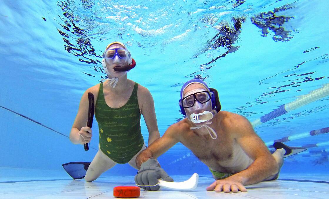Wollongong University Underwater Hockey Club players Eden Brown and Phil Ackerman will represent Australia at the world championships. Picture: KIRK GILMOUR