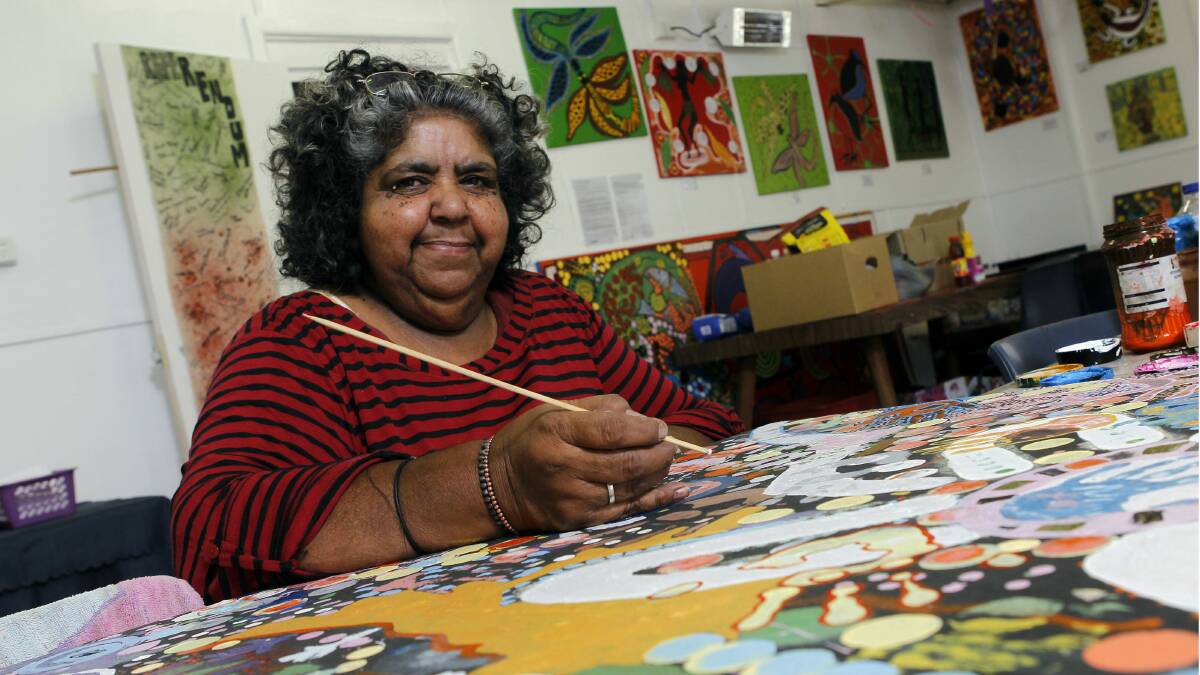 Aunty Lorraine Brown, of Coomaditchie United Aboriginal Corporation, with one of her artworks at the Coomaditchie centre at Kemblawarra. Picture: ANDY ZAKELI