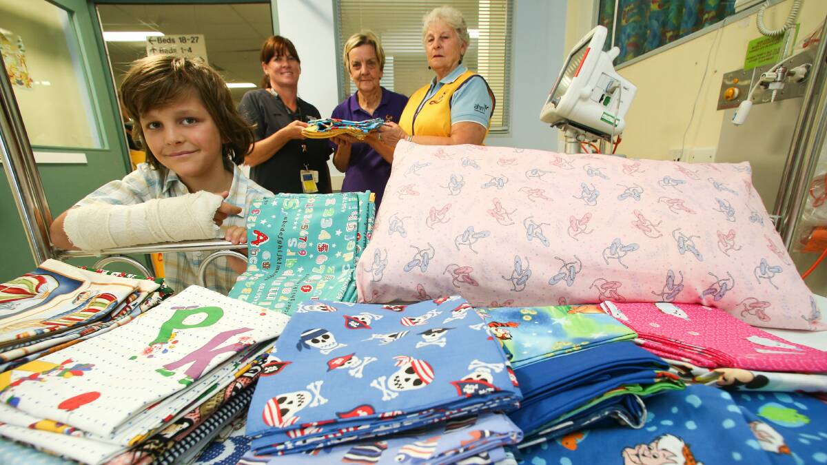 Joseph Passaliokis, 8, Wollongong Hospital Children’s Ward acting nursing manager Narelle Wood, and Wollongong Heights Lionesses Gaye Robinson and Yvonne Parry. Picture: ADAM McLEAN