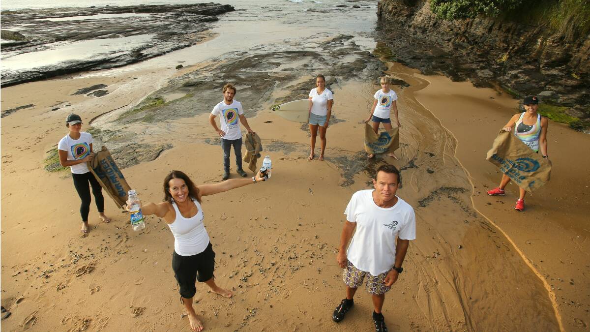 Surfrider Southcoast members (front) Susie Crick, Brian Crick, (rear) Remi Crick, Dave Porter, Stella Crick, Darci Walsh and Leanne Walsh want surfers to help clean up Puckey’s Lagoon on Clean Up Australia Day. Picture:  KIRK GILMOUR