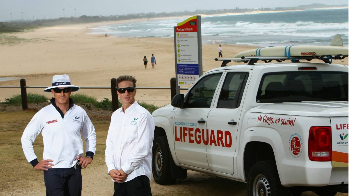 : Wollongong City Council lifeguards Tim Jennett and Jason Foye at Puckeys Beach. City lifeguards are visiting unpatrolled beaches this summer to educate swimmers, encourage them to use the nearest patrolled beach, and gather data. Picture: KEN ROBERTSON