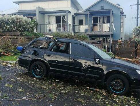 A home and car damaged during a massive storm at Kiama. Picture: ASHLEY SULLIVAN, SES ILLAWARRA