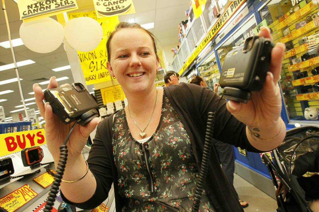 Kaylie McCormack of Warilla looking for a camera at JB Hi-FI. Pictures: DAVE TEASE 