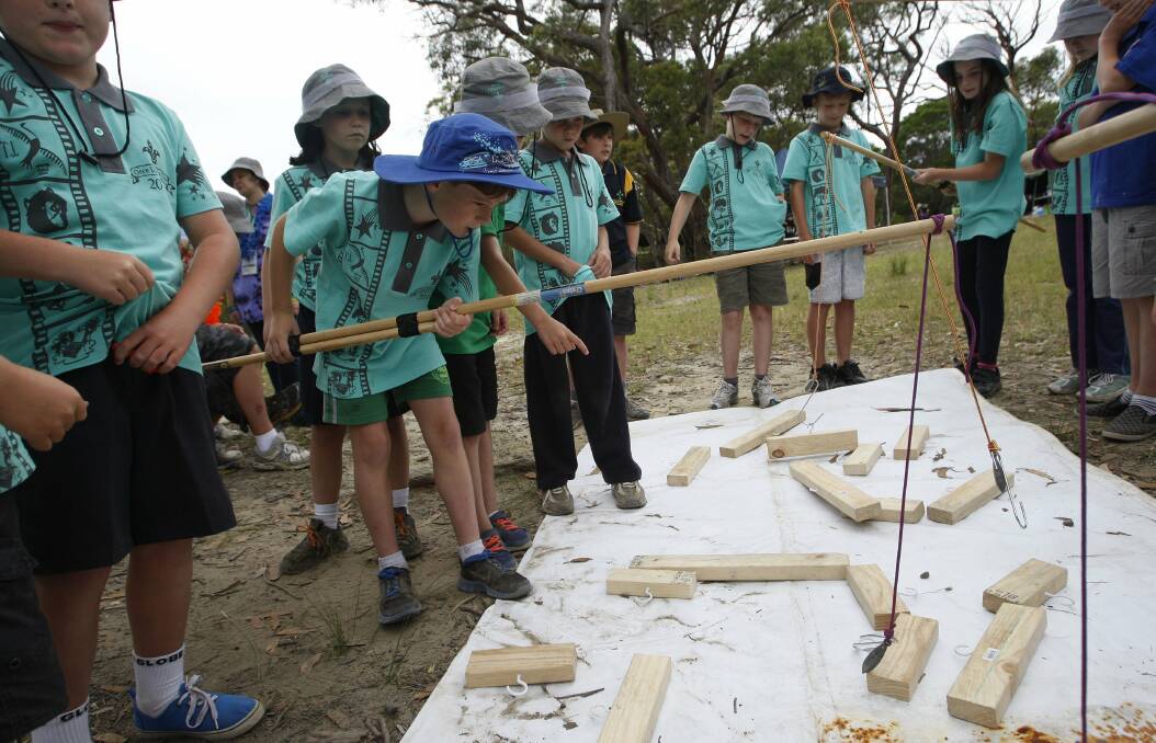 Fishing for wooden blocks are cubs from 1st Russell Vale, including Kurtis Sackett. Picture: ANDY ZAKELI