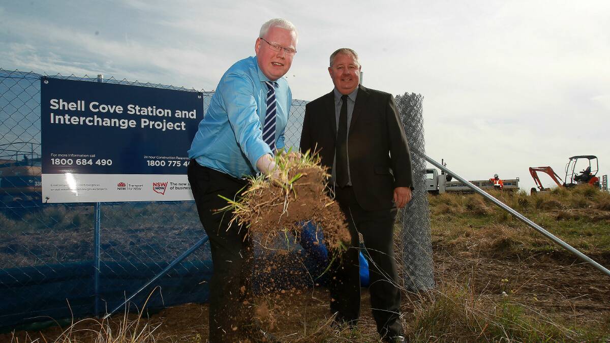 MP for Kiama, Gareth Ward, watched by Shellharbour's Deputy Lord Mayor, Paul Rankin, turns the first sod for the new Shell Cove railway station.  Picture: GREG TOTMAN
