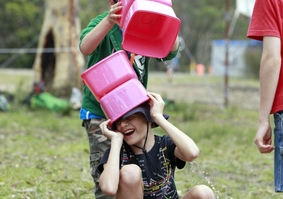 Torsten Junius, of 1st East Wharoonga Cubs gets splashed in a water game. Picture: ANDY ZAKELI