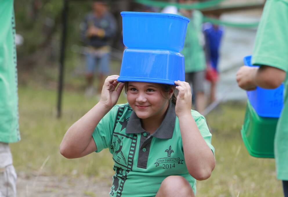 Bella Spears, of 1st Mt St Thomas Scouts, gets ready to catch water. Picture: ANDY ZAKELI