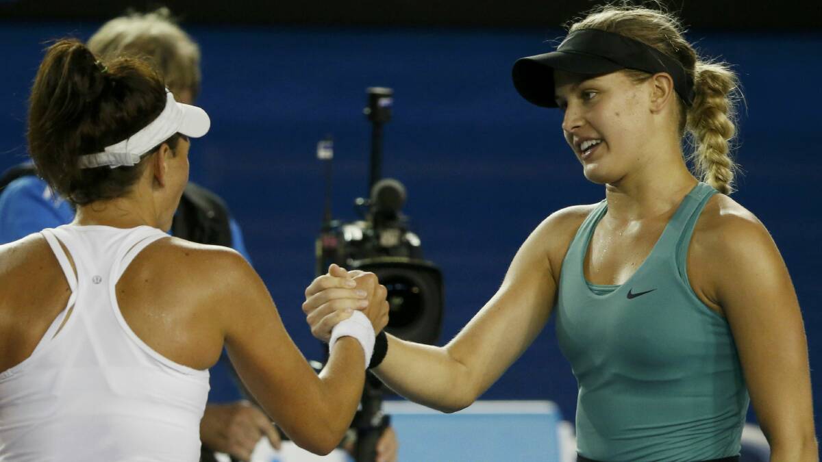 Casey Dellacqua shakes hands with Eugenie Bouchard after last night's match. Picture: REUTERS