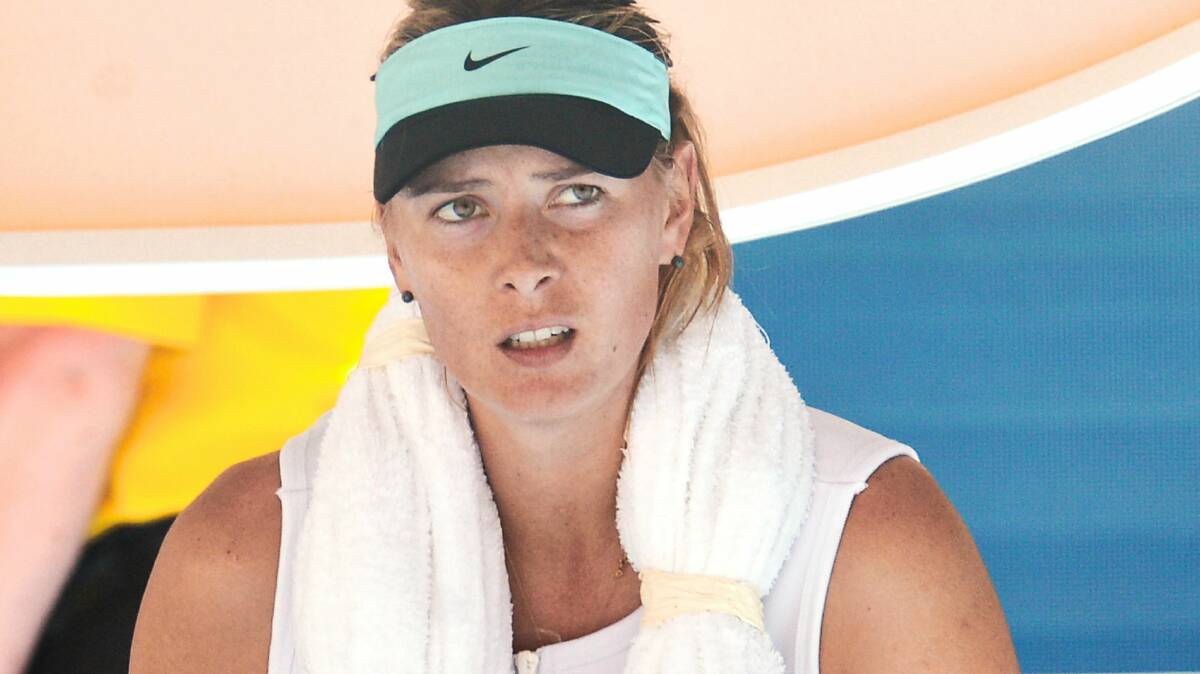 Maria Sharapova cools down during a break in her match yesterday.