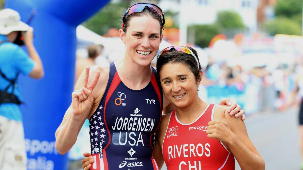 Gwen Jorgensen (left) and Barbara Riveros after finishing first and second in the women's aquathon. Picture: ORLANDO CHIODO