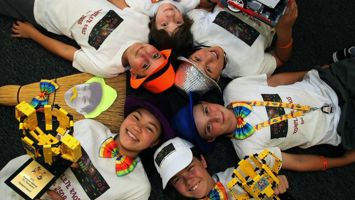 Lego stars (clockwise from bottom left) Nicola Pang (purple hat), a stand-in for absent teammate Matthew Wheatley, Harri Lahtinen, Max Hayes, Jiah Pang, Andrew Christy and Marnie Parkinson are hopefully heading to Spain after coming second in the First Lego League National Championships. Picture: GREG TOTMAN