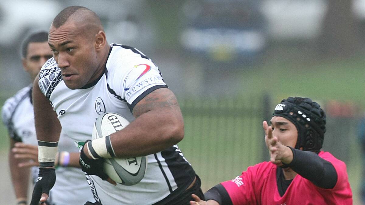 A Brisbane Fijians player makes a break against a Philippines heritage side at last year’s Kiama Sevens. Brisbane Fijians will defend their title. Picture: PAUL JONES