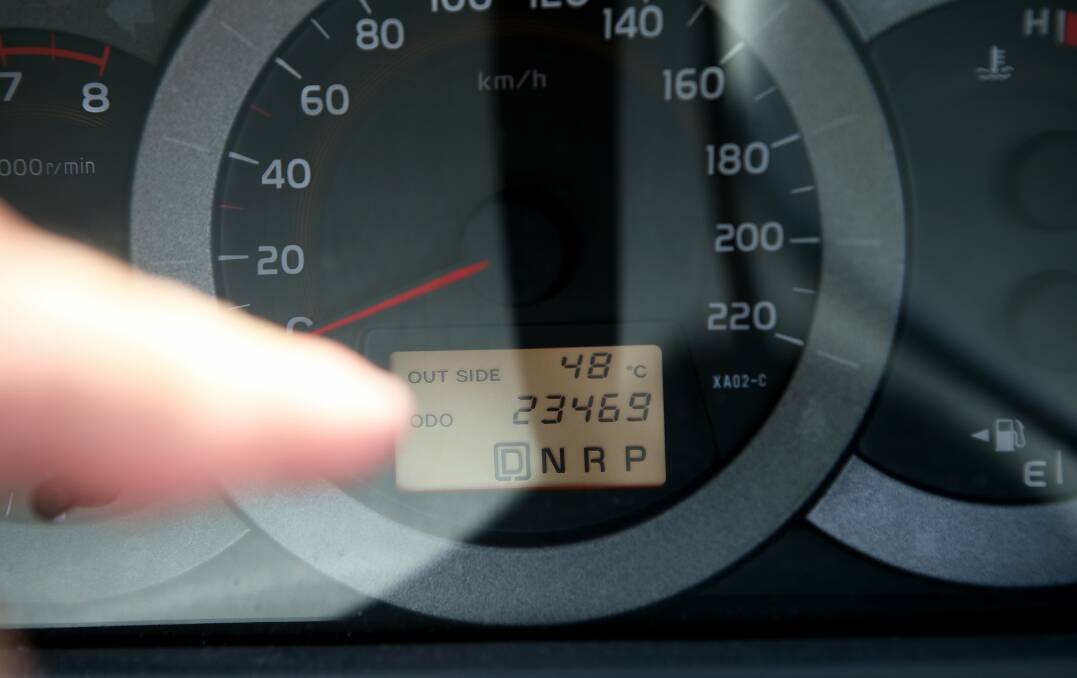 The thermometer in photographer Kirk Gilmour's car shows the outside temperature at Gwynneville at 48 degrees.