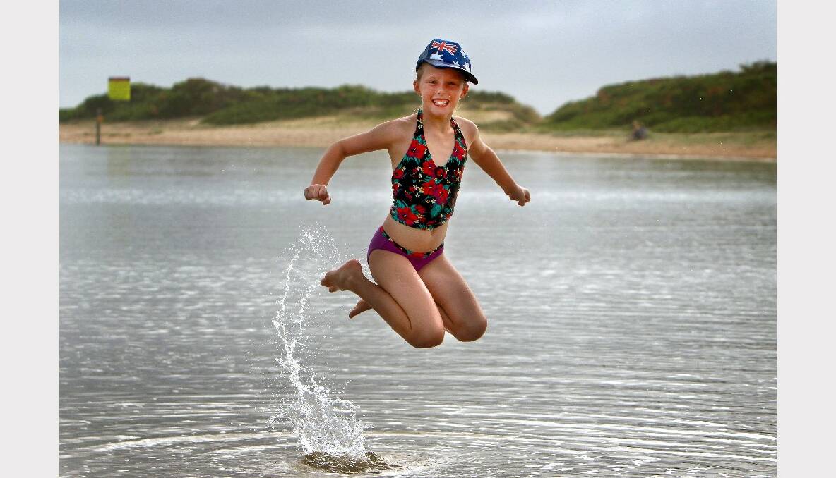 Olivia Sowerby, 9, of Warilla celebrating at Lake Illawarra. Pictures: SYLVIA LIBER
