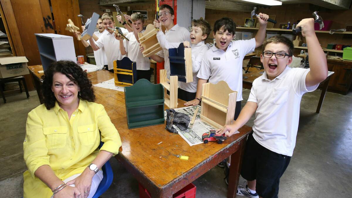 Diane Burns with some of her junior Men’s Shed students. Picture: KIRK GILMOUR