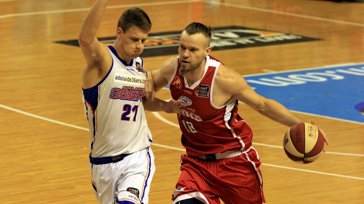 The Hawks Larry Davidson in action against Adelaide's Daniel Johnson. Picture: ORLANDO CHIODO