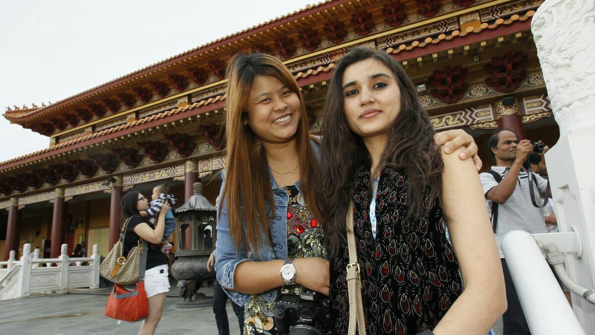 Ashoda Rai and Karishme Adhikari, both from Sydney, visit Nan Tien Temple. Pictures: DAVE TEASE
