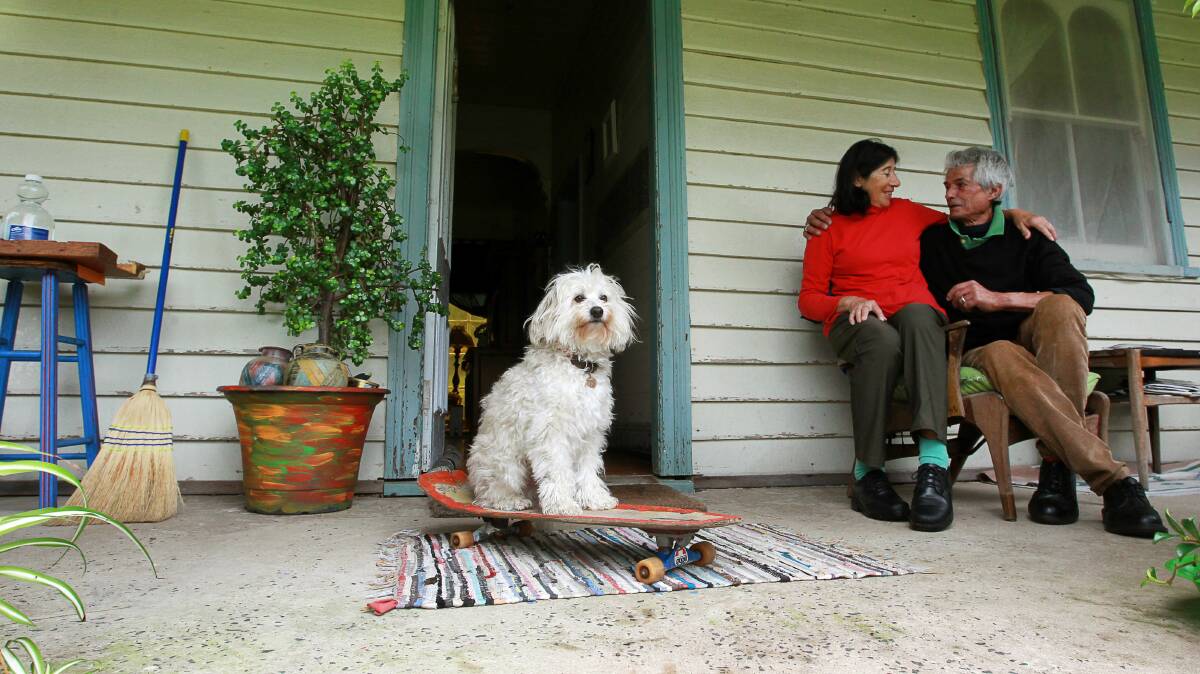 Maria and Carlos de Ferrari with their dogs Brando and Josie outside the home. Pictures: SYLVIA LIBER