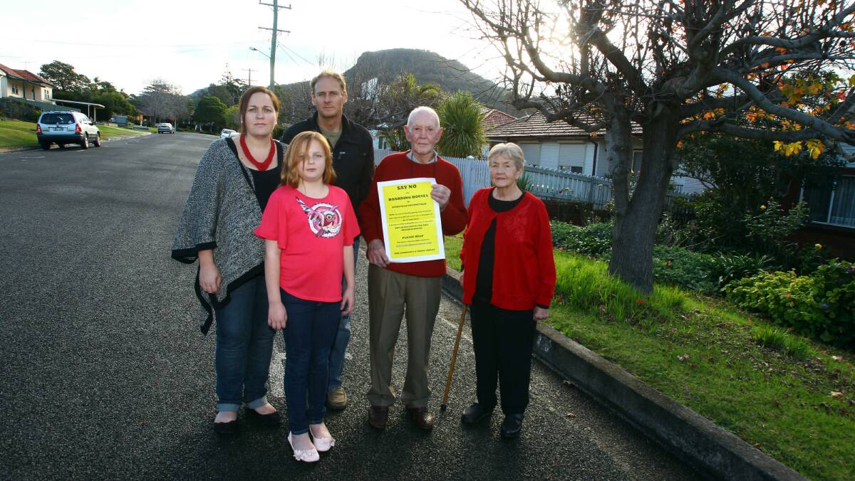 Gwynne Street residents, from left, Alison, Grace and Evan Doyle with Neville (holding a letter of objection) and Florence Brown, who are against the proposed development. Picture: KEN ROBERTSON
