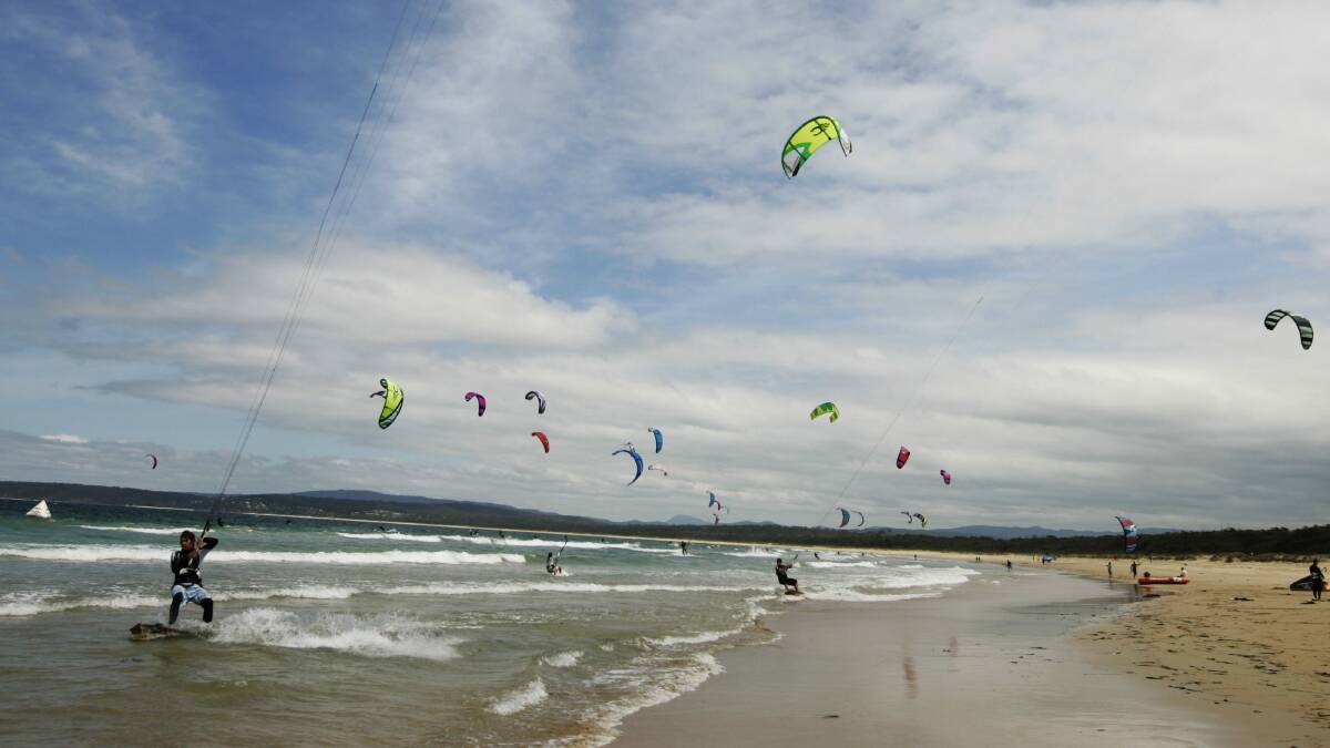 Kitesurfers at Merimbula Beach. Picture: JAMES BRICKWOOD