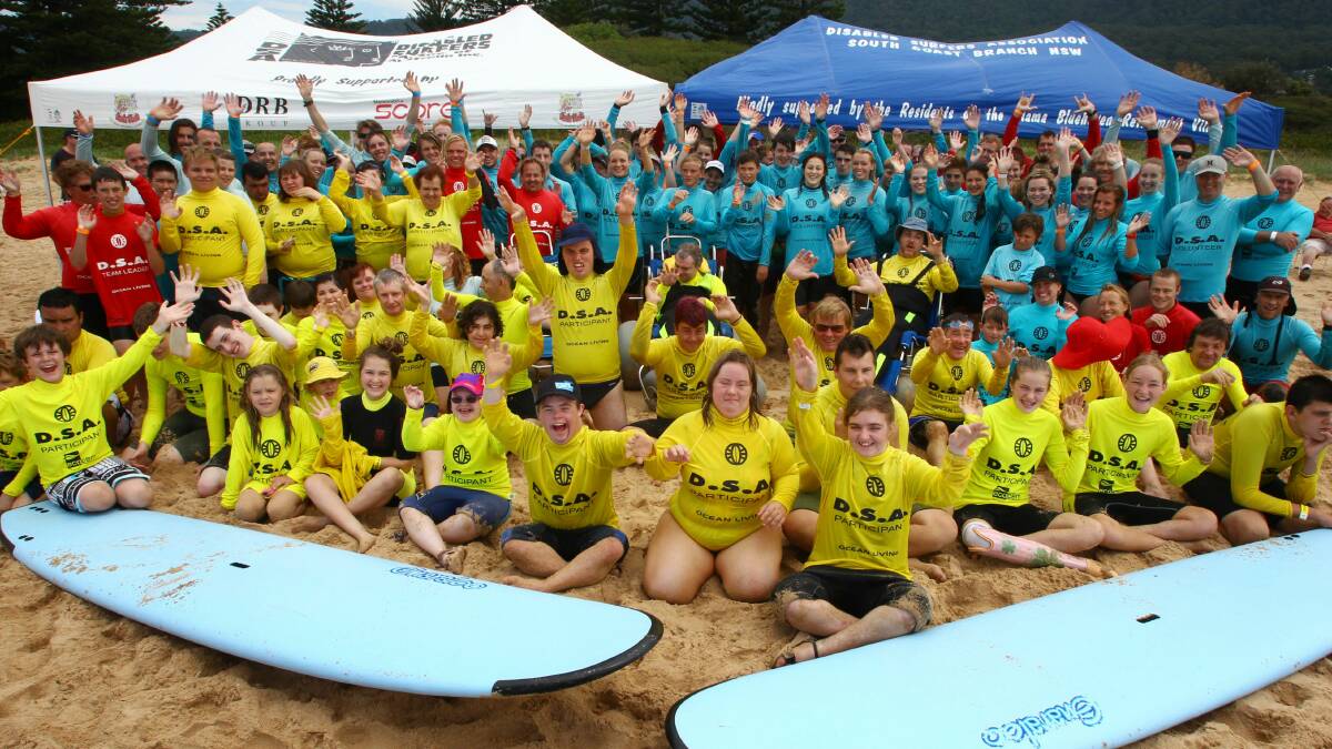 Members of the South Coast Disabled Surfers Association enjoy the day at Thirroul Beach. Pictures: KEN ROBERTSON