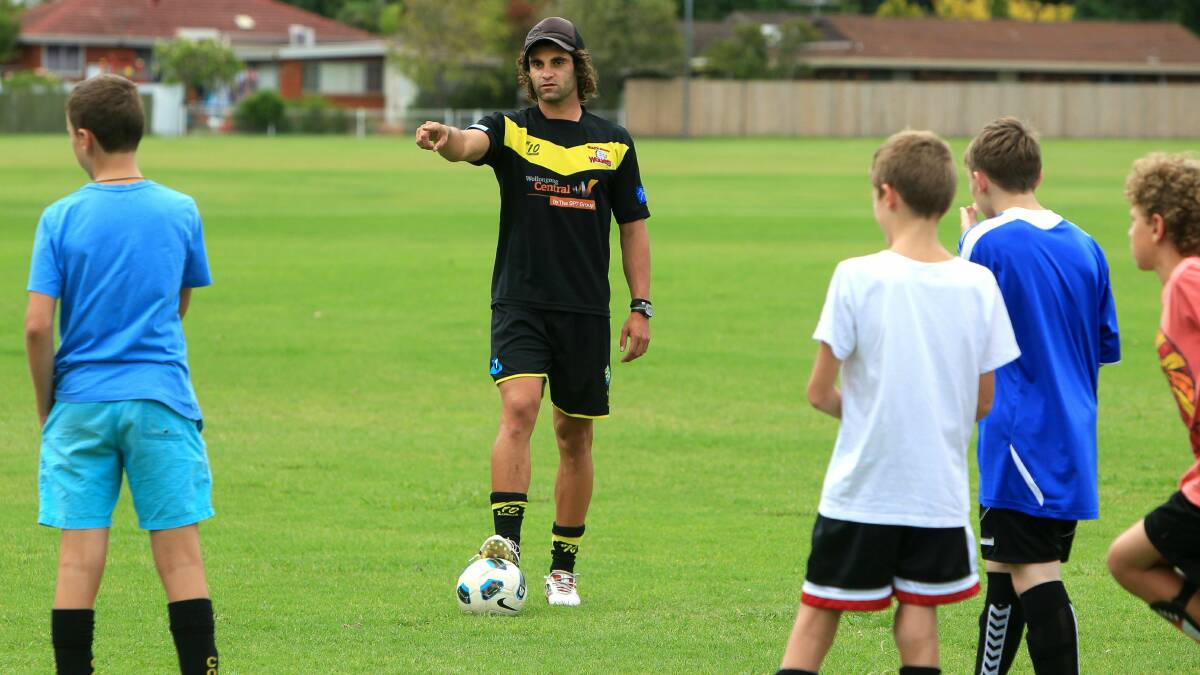 Wolves player Jacob Timpano works drills with youngsters at Judy Masters Oval.  Picture: SYLVIA LIBER