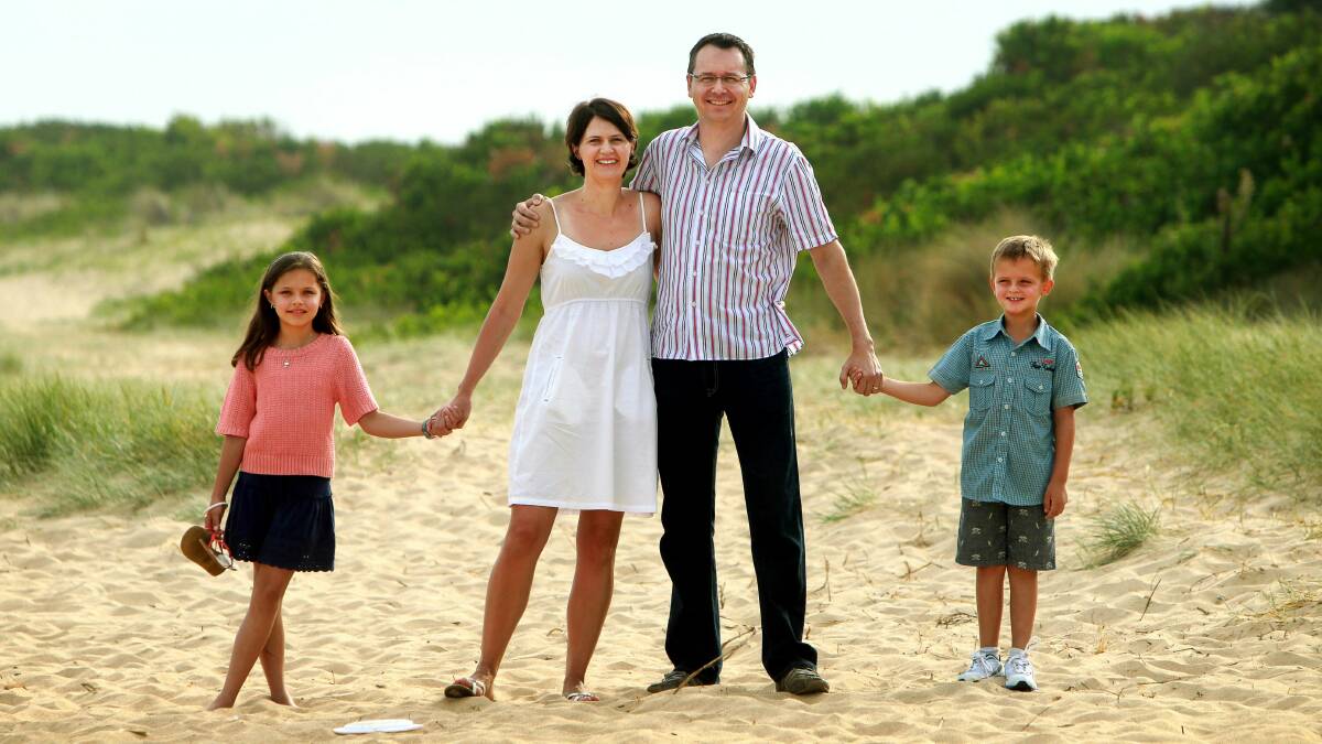 The Burger family celebrate their new citizenship with  a stroll at Lake Illawarra. Picture: SYLVIA LIBER