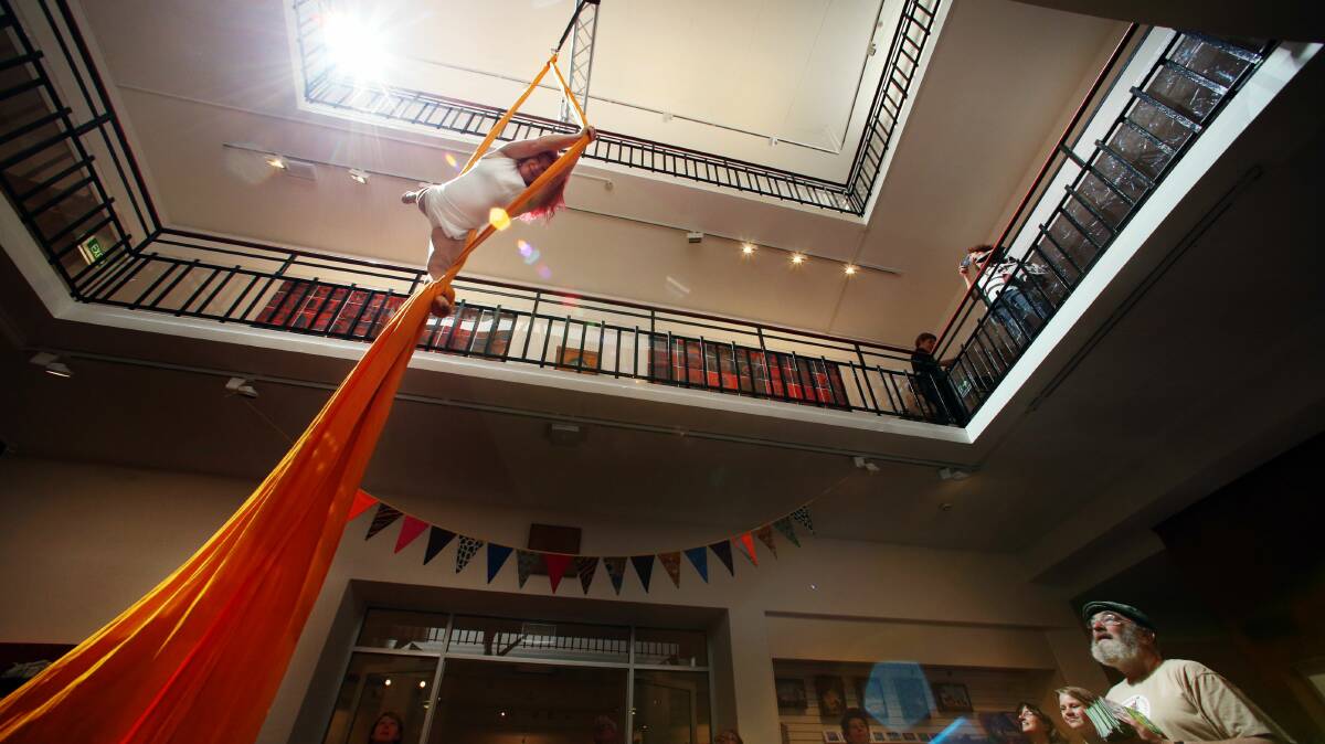 Kristina Dzelmanis performs aerial silk acrobatics  at the Viva la Gong official launch at Wollongong City Gallery last Friday. Picture: ADAM McLEAN