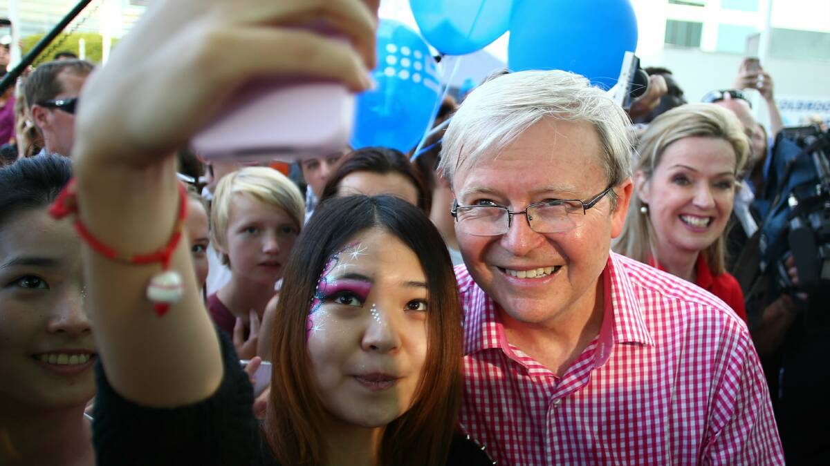 Prime Minister Kevin Rudd poses with a fan at Brisbane's Ekka Show on the campaign trail last week. Picture: Andrew Meares 