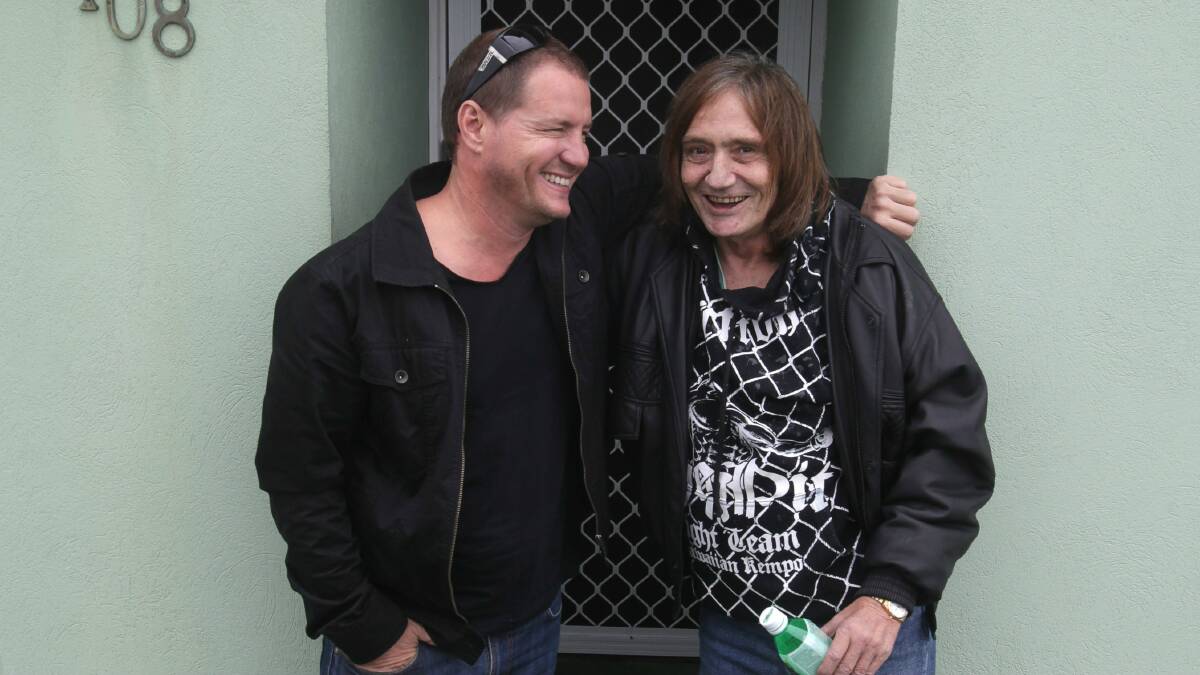 Scott McRae and Stevie Wright at the rock legend's South Coast home. Picture: KIRK GILMOUR