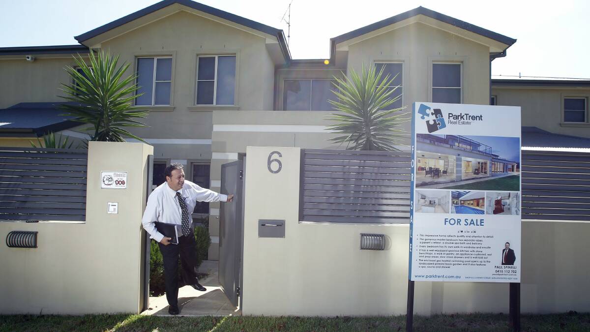Real estate agent Paul Spinelli at an Albatross Street home in Blackbutt. Picture: ANDY ZAKELI