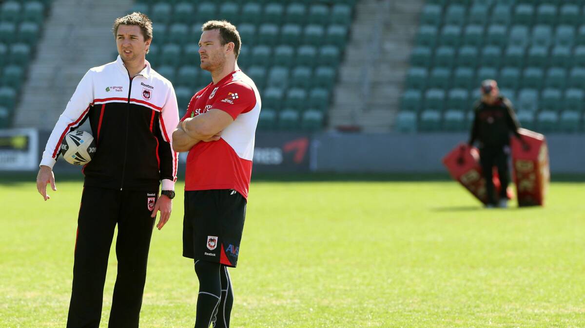 Dragons coach Steve Price, left, with player Dean Young last year. 