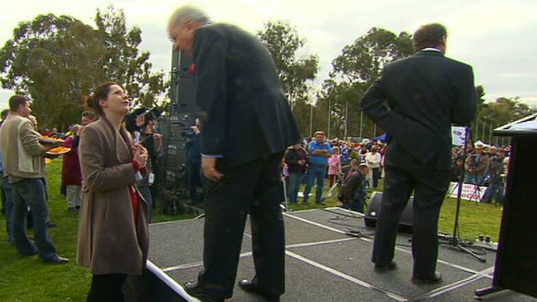 Sydney Morning Herald journalist Jacqueline Maley speaks with broadcaster Alan Jones at the rally. 
