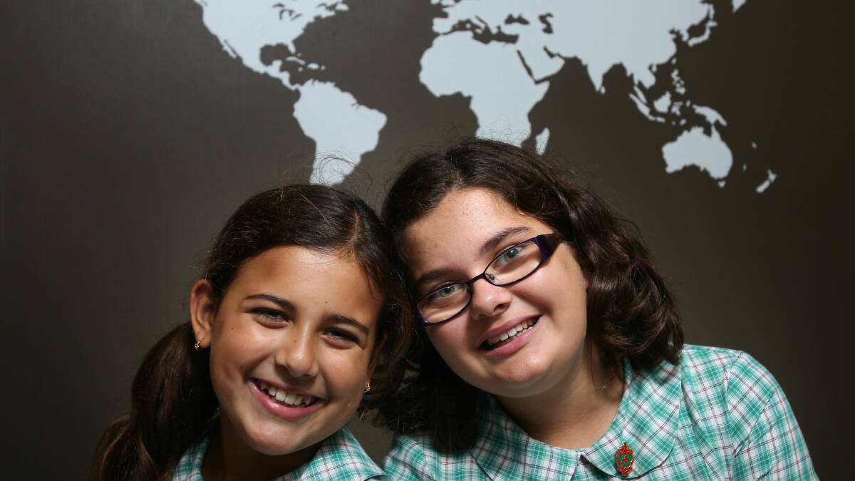  Tahnee Chandler, 10, and Gabriella Cesare, 11, get ready to take on the world. Pictures: KEN ROBERTSON
