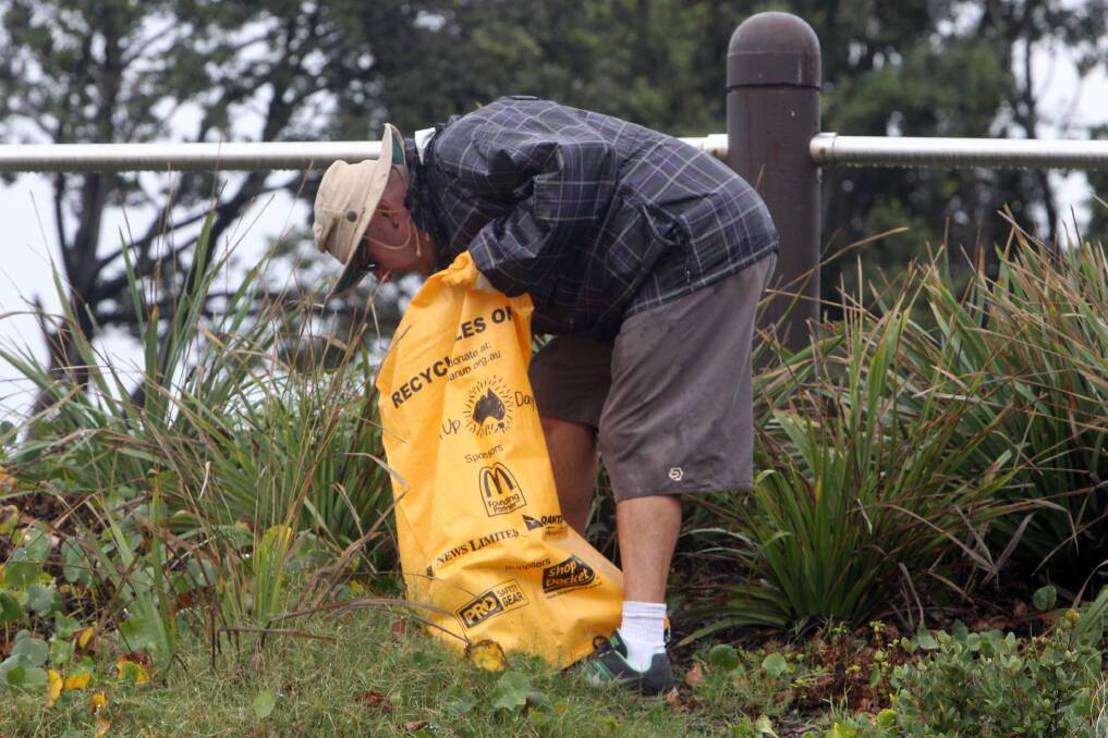Mark Rylander helps clean up Puckeys Lagoon. Picture: GREG TOTMAN