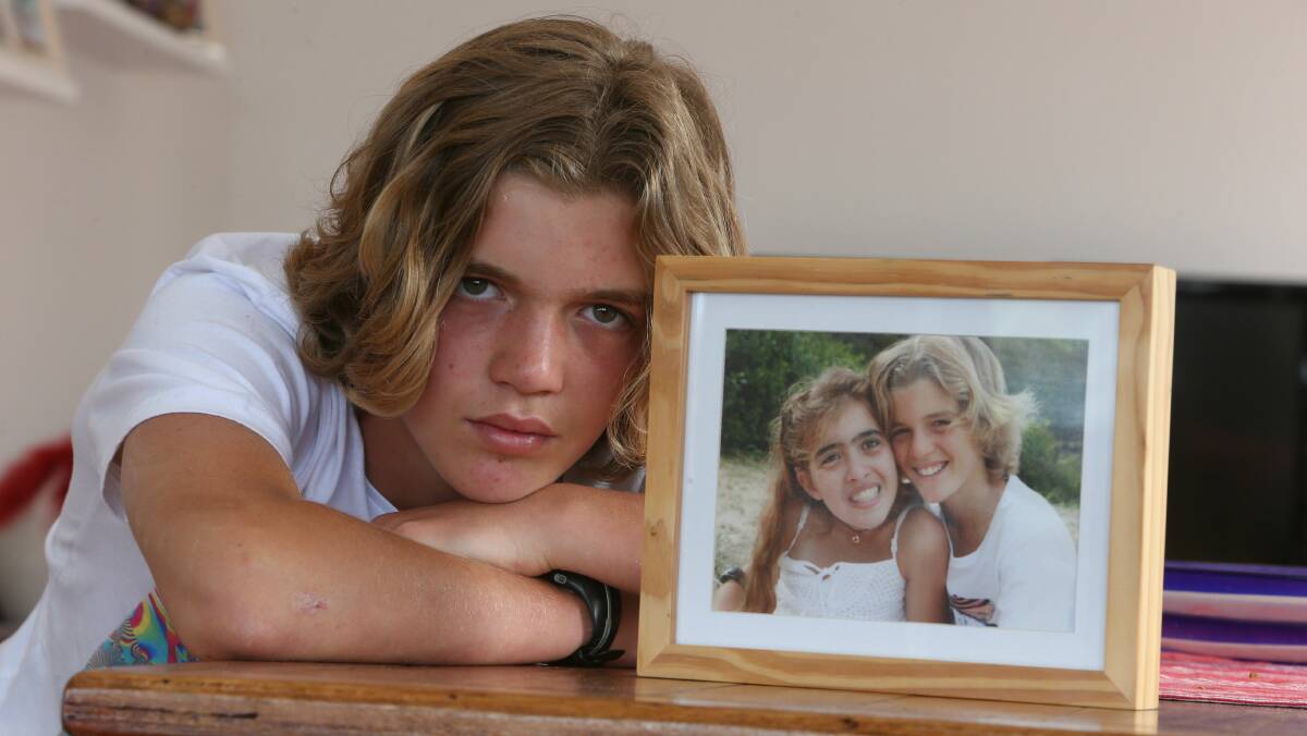 Henry Kocatekin of Wombarra with a photo of himself with his sister Alice. Picture: ROBERT PEET