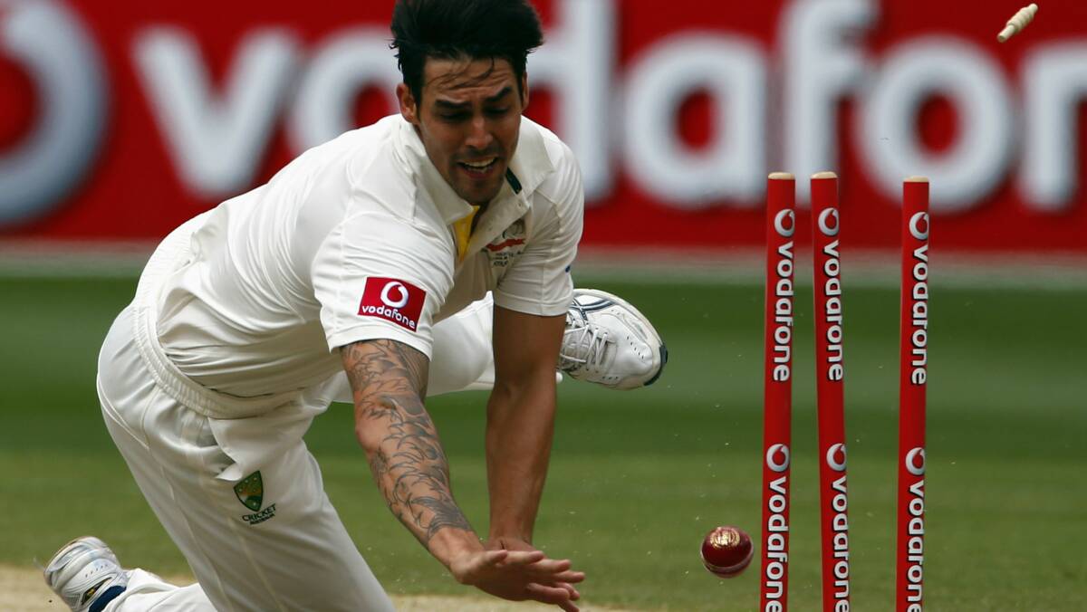 Mitchell Johnson runs out opener Dimuth Karunaratne for one run during the first over of Sri Lanka's second innings. Photo: Reuters