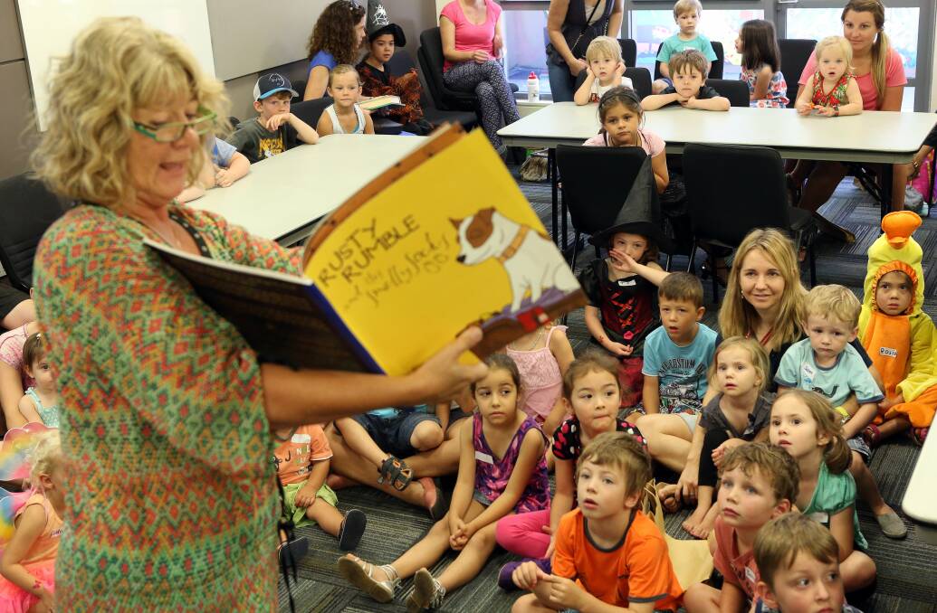 Author Dianne Ellis reads to children and parents. Picture: KIRK GILMOUR