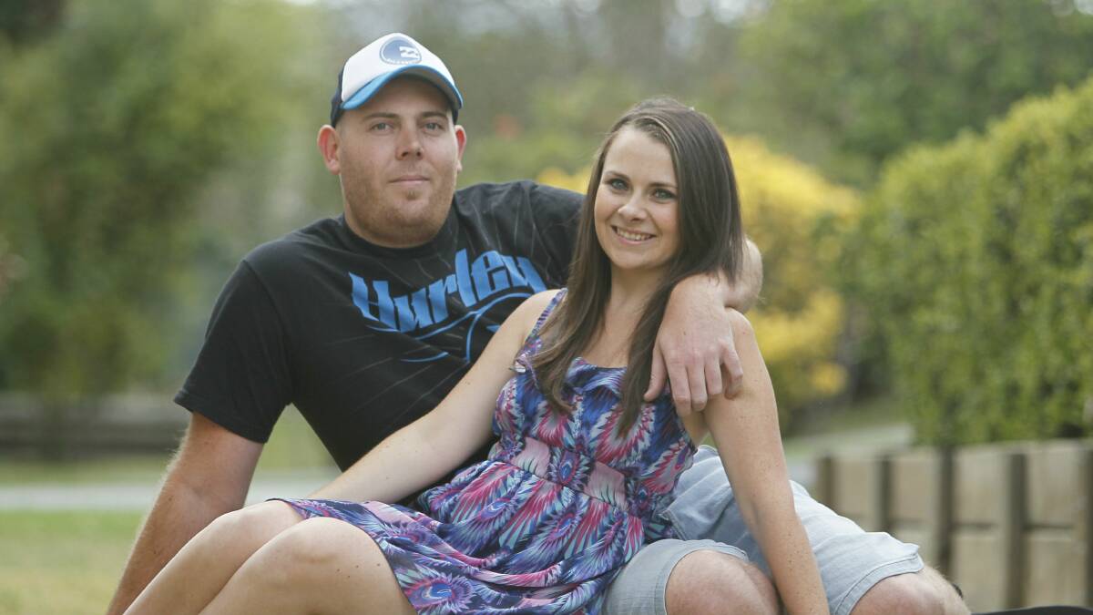 Erin Richardson and Shaun Duncan at home, planning a cloud nine wedding. Picture: DAVE TEASE