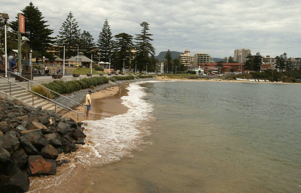 King tide: Larry Jennett at Brighton Beach, 9.32am. Pictures: KIRK GILMOUR, SYLVIA LIBER