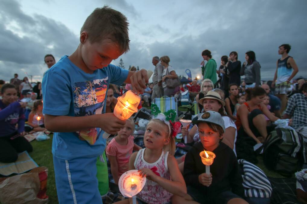 Blayse lights a candle at Reddall Reserve. Picture: ADAM McLEAN