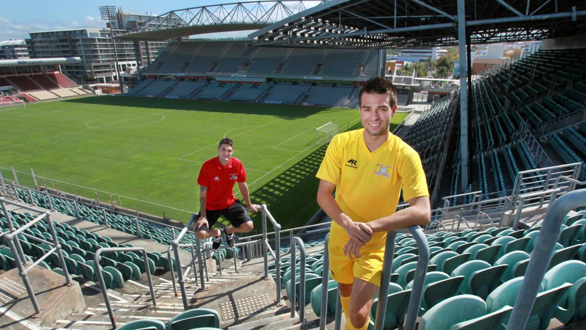 Sydney FC star Corey Gameiro, a former Wolves player, and South Coast's Peter Simonoski. Picture: ORLANDO CHIODO