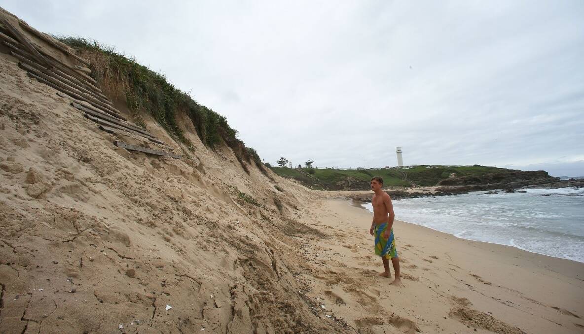 Nick Treloar of Wollongong looking at the erosion at City Beach on Friday. Picture: ADAM McLEAN
