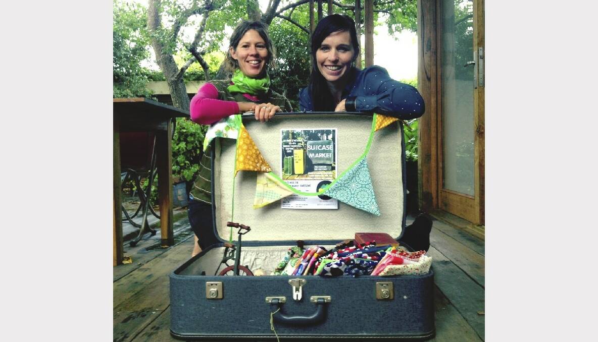 Caitlin Marshall and Lizzie Rose make a market in their suitcase to help establish their Wild Rumpus idea.